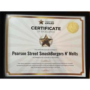 Framed "Canadian Choice Award of Excellence" certificate for Pearson Street Smash N' Melts mobile kitchen, recognizing entrepreneurial spirit and service in the restaurant category.